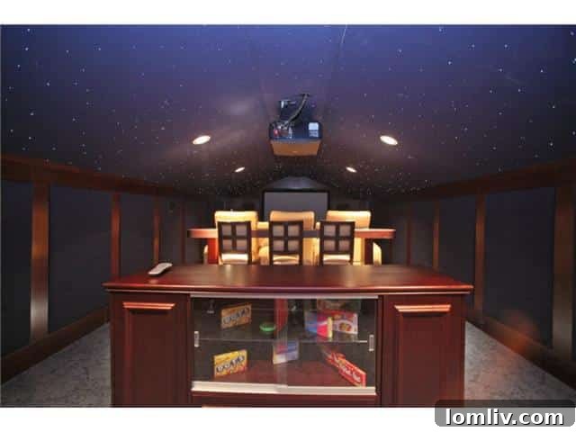 Troy Aikman's Normandy Home Under New Ownership 22 State-of-the-art home theater, equipped with comfortable seating and a large screen for cinematic experiences.