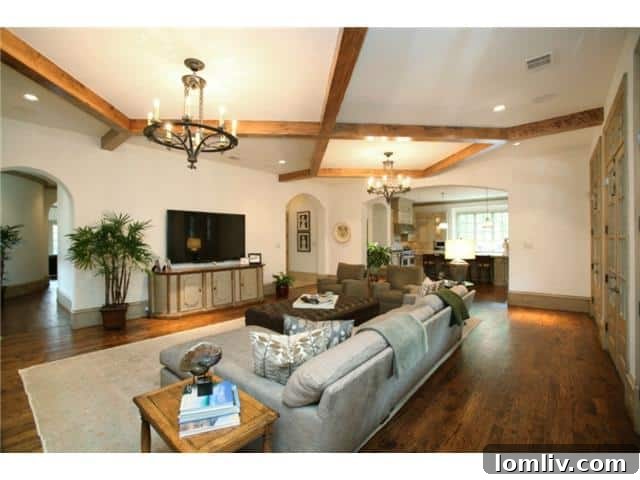 Troy Aikman's Normandy Home Under New Ownership 6 Another perspective of the elegant family room, highlighting its spacious layout and tasteful furnishings.