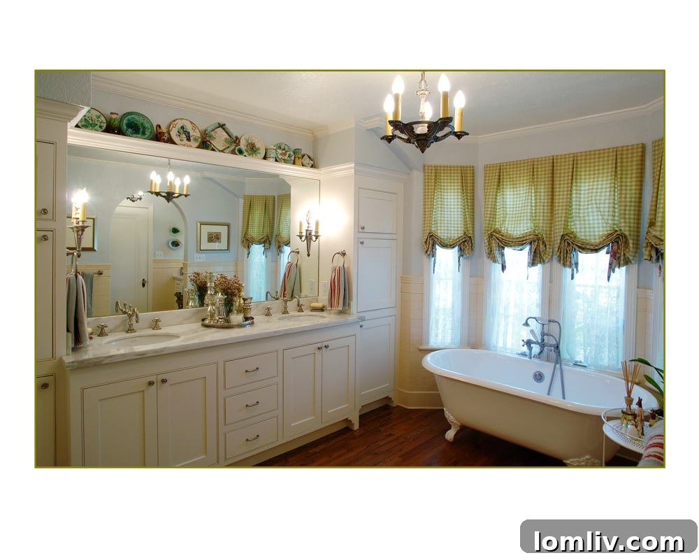 Spa-like master bathroom with claw-foot tub and marble counters