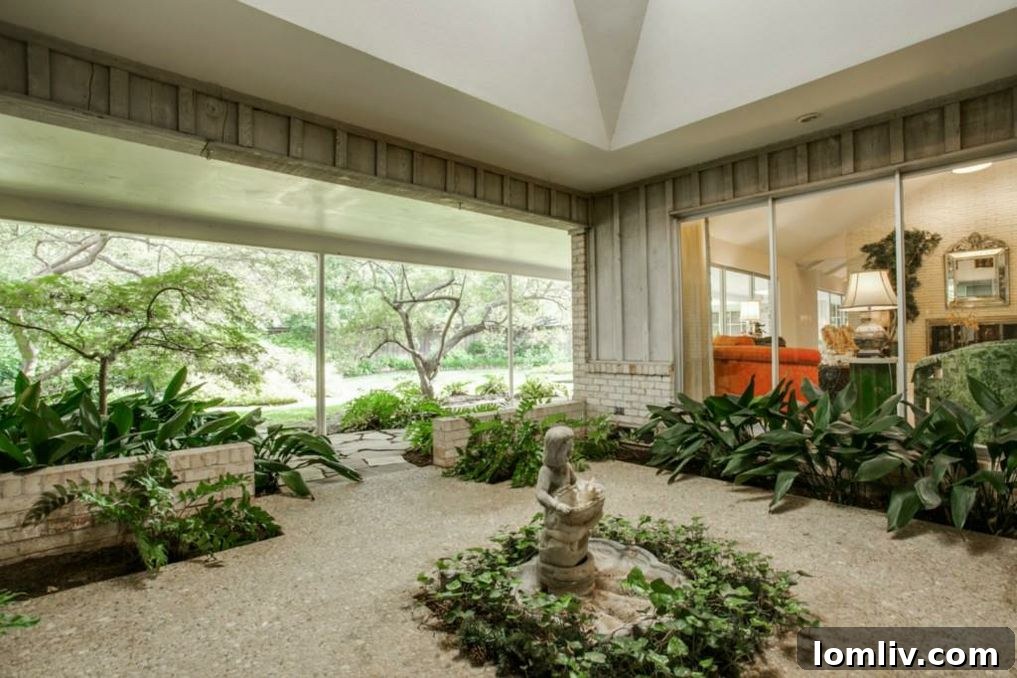 Majestic oak tree dominating the circular drive at the front of the home