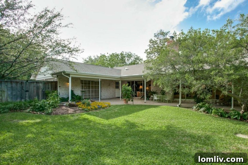 Green backyard with mature trees and ample space for outdoor activities