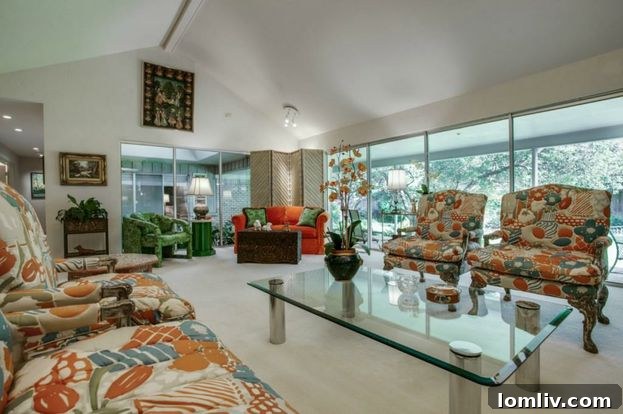 Living area with fireplace and period details in the historic Dallas house