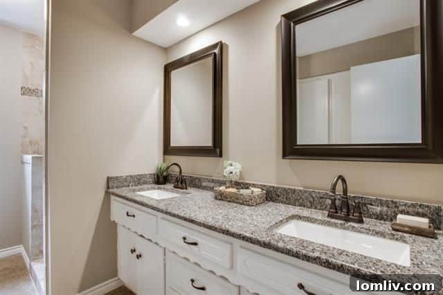Master bathroom vanity with dual sinks and granite countertop