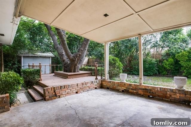 The backyard's covered patio, ideal for outdoor entertaining