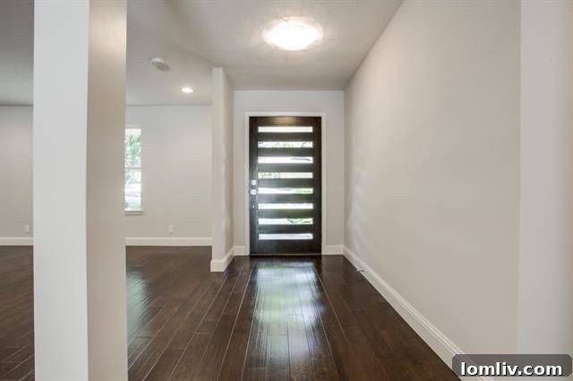 Spacious Dining Area with Modern Lighting and Kitchen View