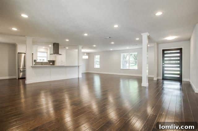 Contemporary Front Exterior with Painted Brick and Landscaping