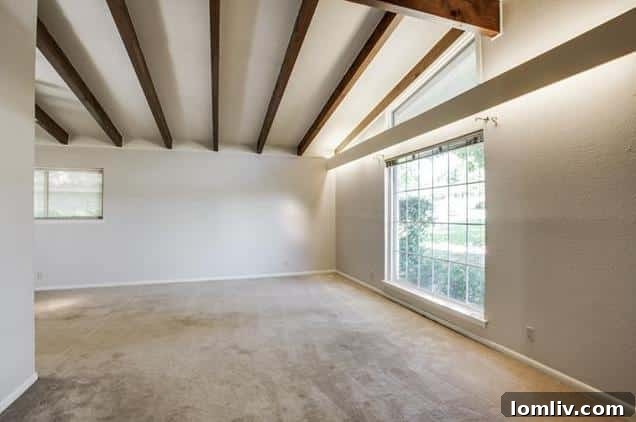 Open concept living space with potential for modern updates in a Merriman Park home