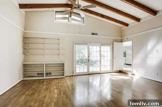 Another view of a living space, highlighting its spaciousness and natural light potential