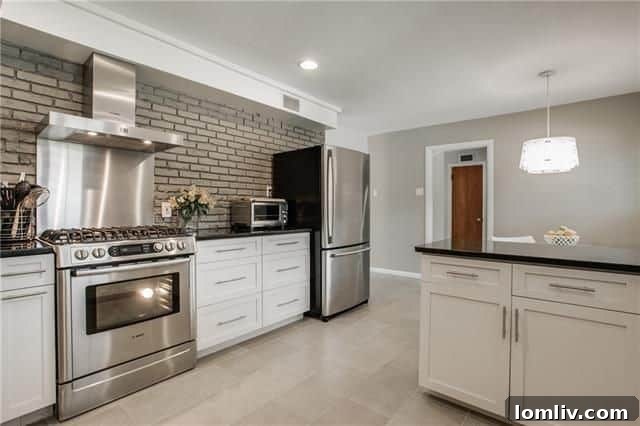 Kitchen with gas cooktop and stainless steel appliances