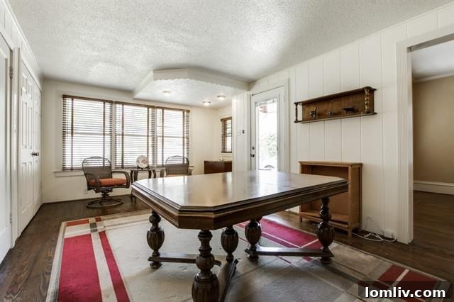 Master bedroom with a cozy seating area