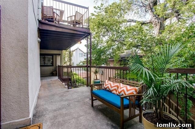 Vibrant Oak Lawn street scene with rainbow flags and bustling shops