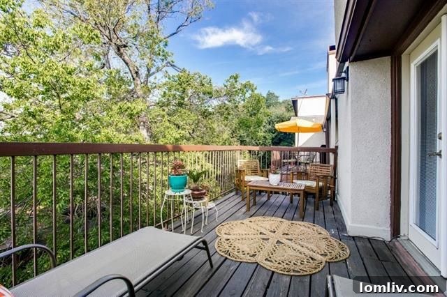 Second bedroom with fireplace and access to a private balcony