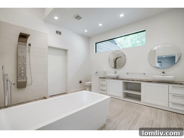 Midway Hollow Retreat: Open Layout, Wraparound Porch, and an Irresistible Master Bath 14 Elegant Master Bath with Dual Vanities and Modern Fixtures