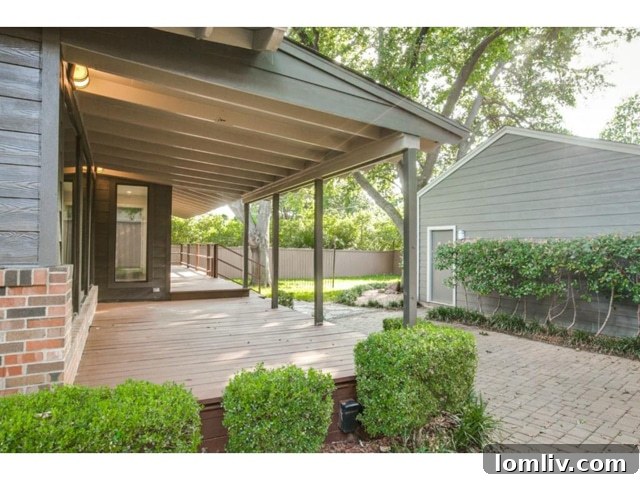 Spacious Backyard Deck with Lush Green Landscaping