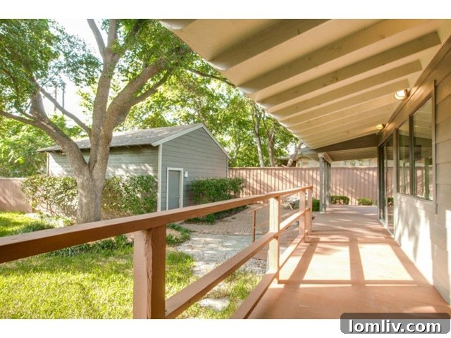Midway Hollow Retreat: Open Layout, Wraparound Porch, and an Irresistible Master Bath 17 Private Outdoor Living Area with Ample Space for Activities