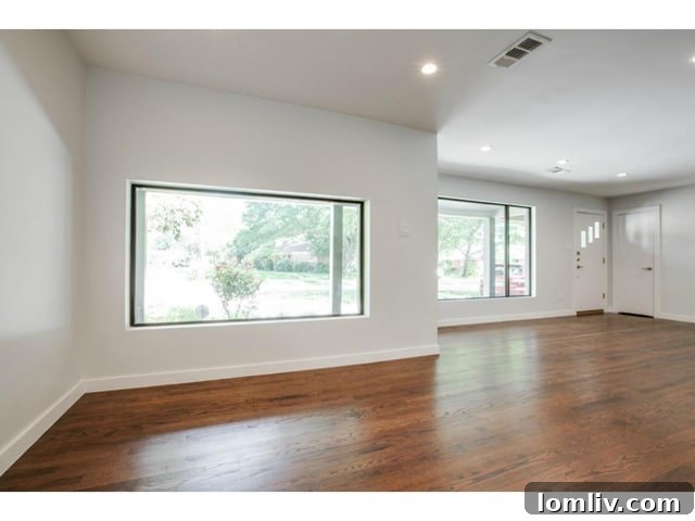 Midway Hollow Retreat: Open Layout, Wraparound Porch, and an Irresistible Master Bath 4 Elegant and Spacious Dining Area Adjacent to the Living Room