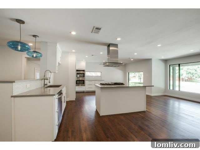 Midway Hollow Retreat: Open Layout, Wraparound Porch, and an Irresistible Master Bath 8 Spacious and Functional Kitchen with Quartz Countertops