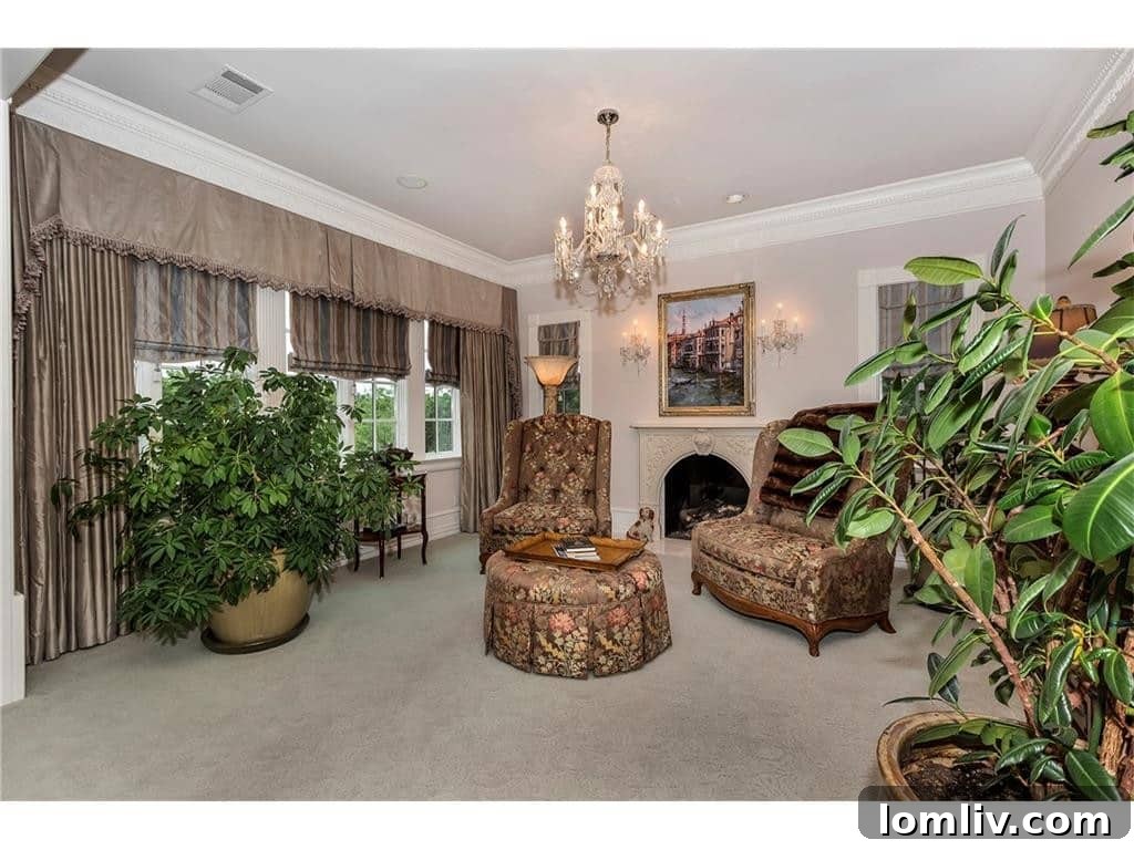 Master Bedroom Sitting Area with Fireplace and Plush Seating
