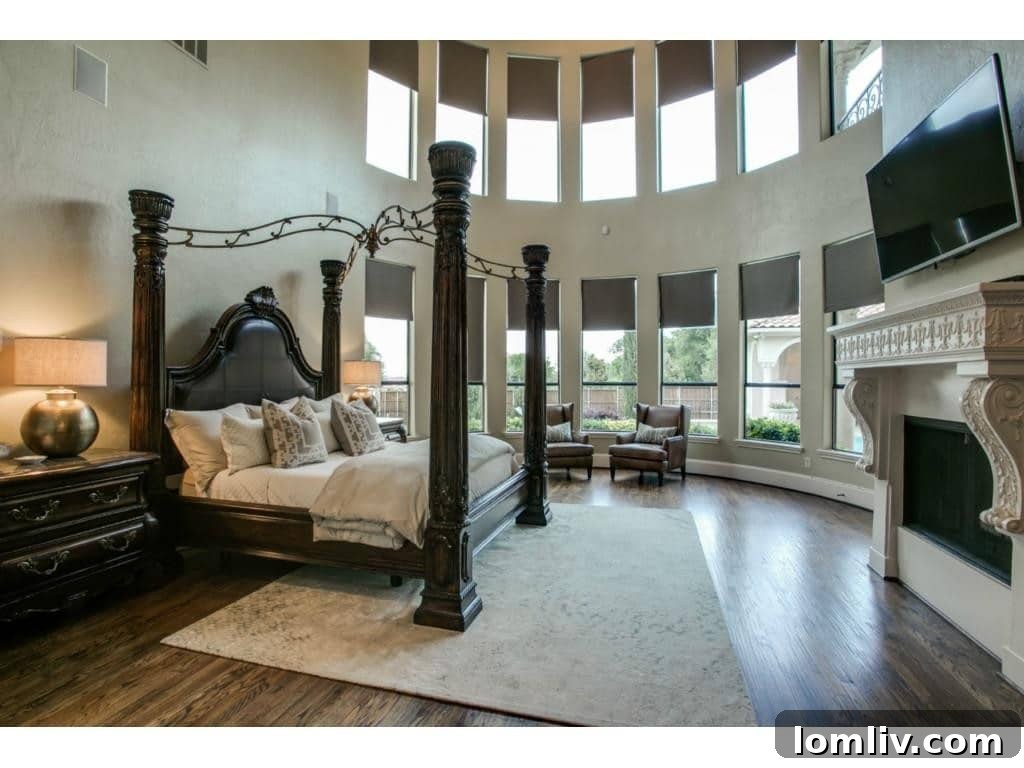 The grand master bedroom, complete with a cozy fireplace and coffee bar.