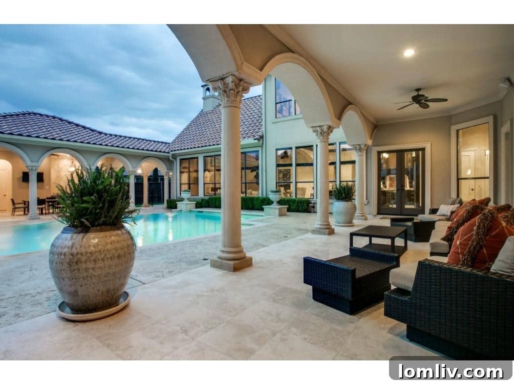 The stunning resort-style swimming pool, a centerpiece of the luxurious backyard.