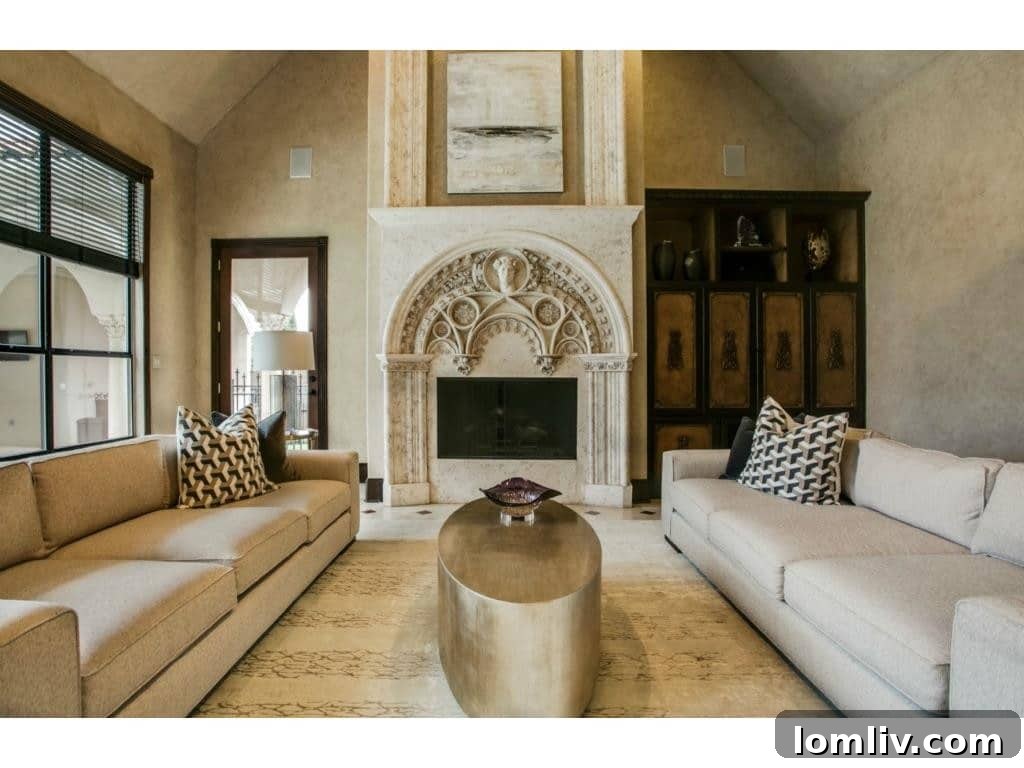The spacious family room featuring a unique concrete fireplace.