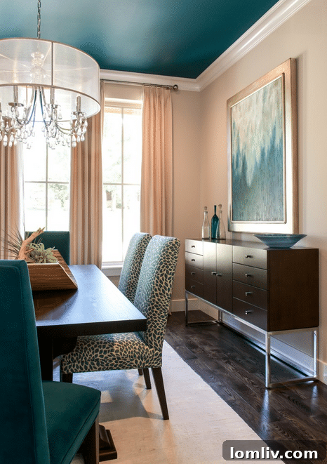 Dining room detail showcasing teal accents and neutral palette