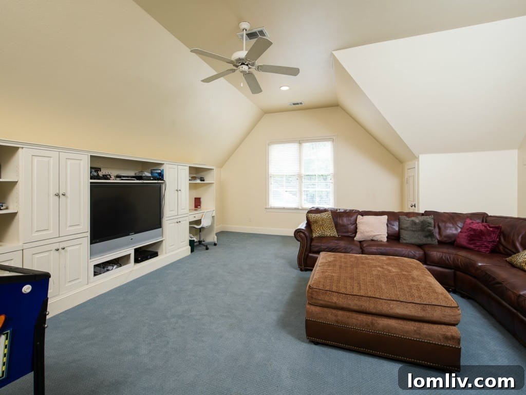 Versatile game room or playroom upstairs at 3325 Greenbrier, providing a dedicated space for family entertainment and activities.