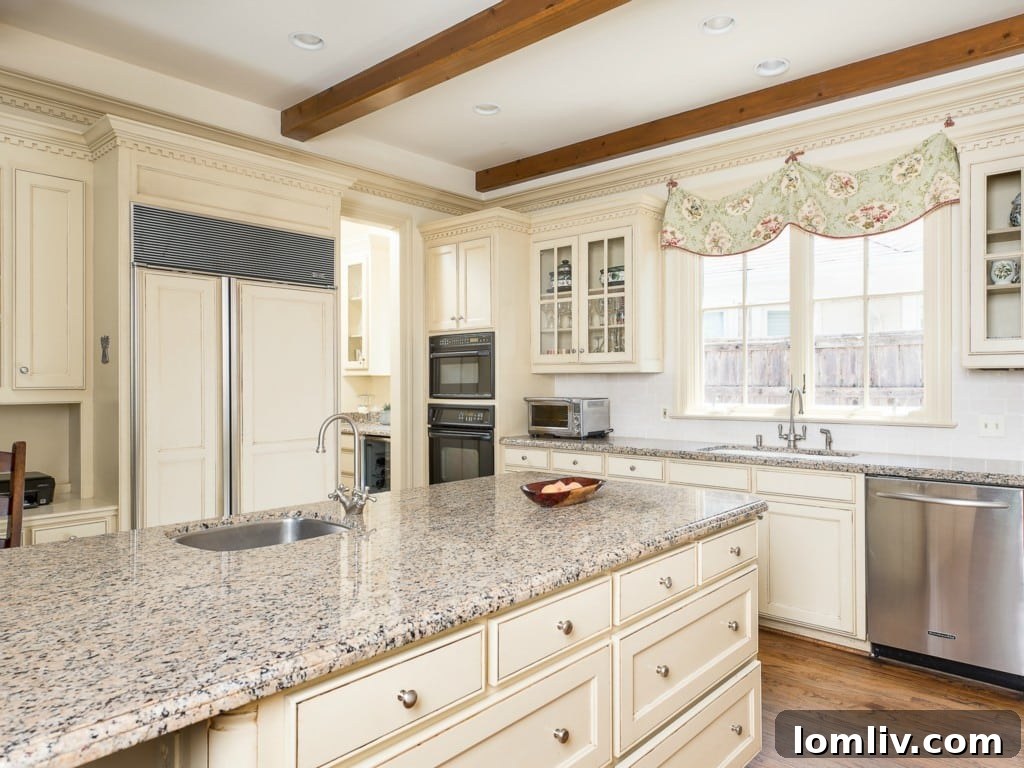 Spacious, updated kitchen at 3325 Greenbrier featuring light granite countertops, custom cabinetry, and modern appliances.