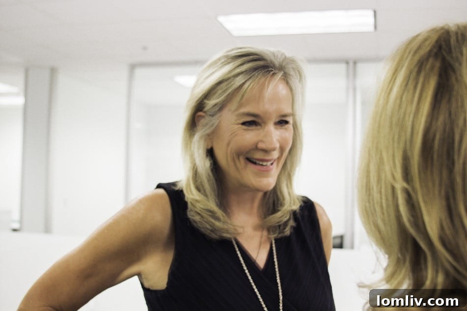 Becky Oliver, a local East Dallas real estate expert, smiling at the Briggs Freeman Sotheby's event.