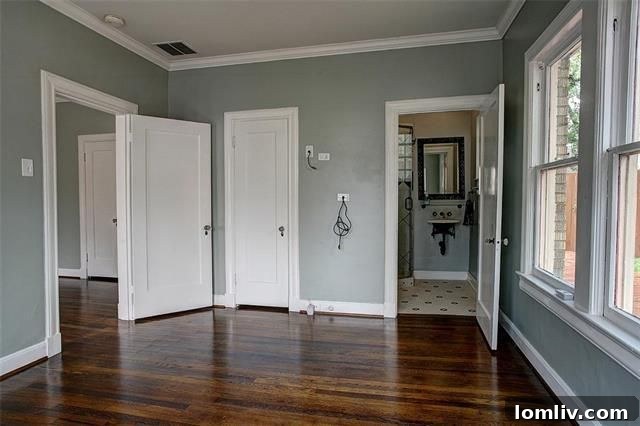 Master bathroom with vintage stained glass window and modern updates