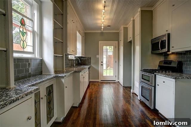 Newly renovated kitchen at 510 Cordova Street with granite countertops and stainless steel appliances