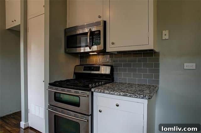 Another perspective of the updated kitchen with a built-in shelf and modern fixtures