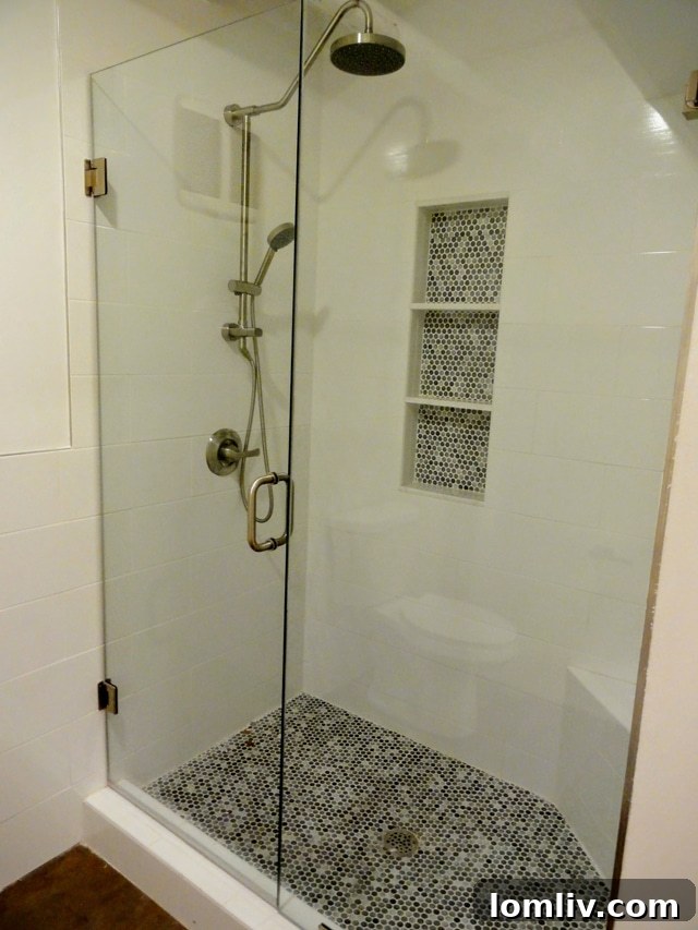 Modern glass shower enclosure in one of Suite 250's stylish bathrooms