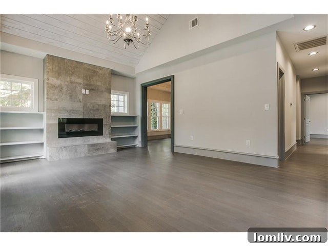 Elegant Living Space with Modern Chandelier and Barn Door