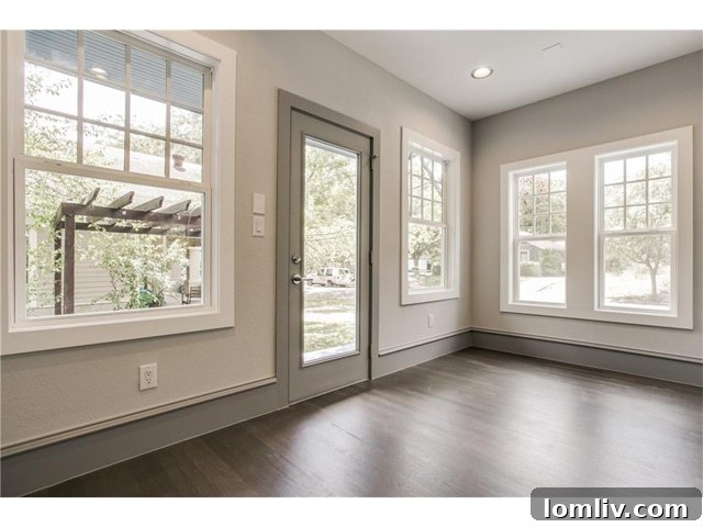 Bright Sunroom with Large Windows and Garden Views