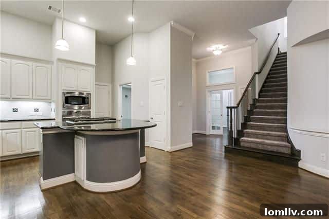 Open concept living area with high ceilings in Far North Dallas home