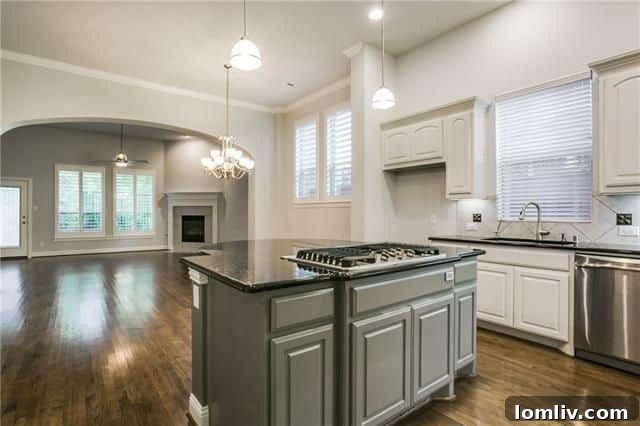 Gourmet kitchen with white cabinets and granite counters in 18230 Brighton Grn.