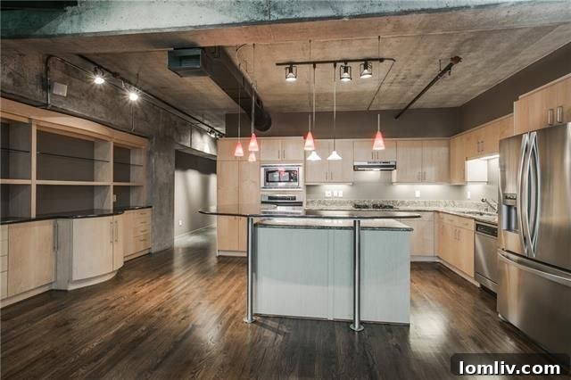 Bedroom with city views in Uptown loft