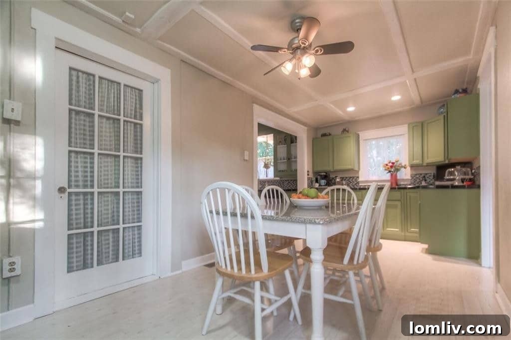 Bright and inviting breakfast room, formerly an enclosed porch