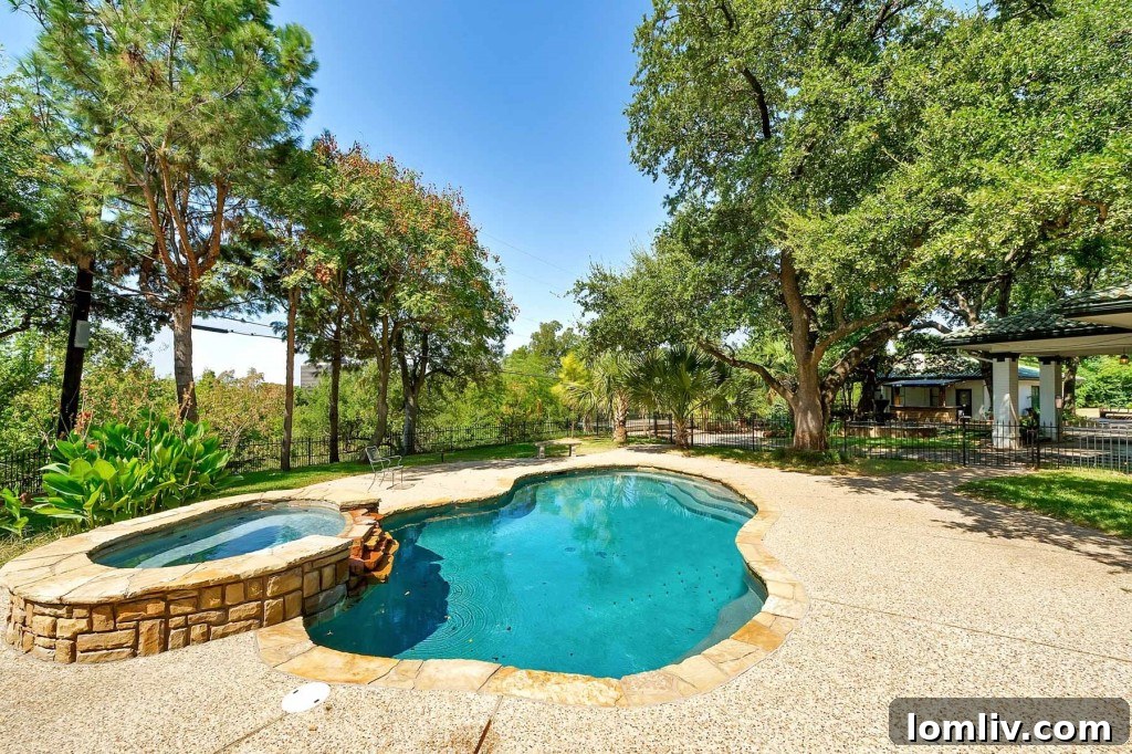 Mystical Allure of Mistletoe Heights Historic Villa 21 Serene Organic Form Pool with Spa and Stone Fountain in Historic Fort Worth Estate