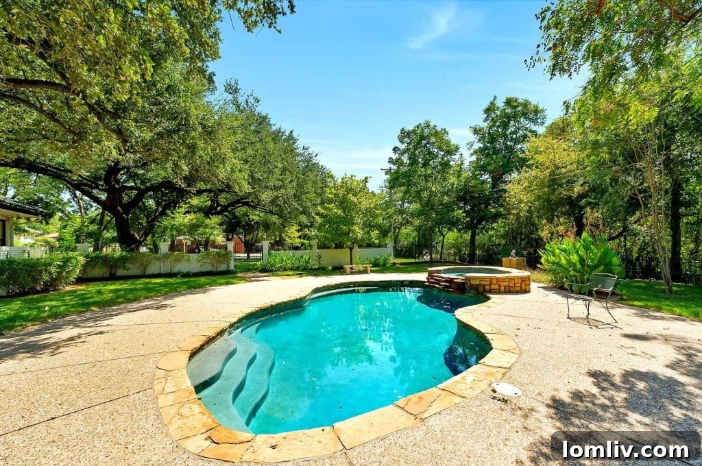 Mystical Allure of Mistletoe Heights Historic Villa 22 Lush Poolside Area Perfect for Relaxation and Entertaining with River Views