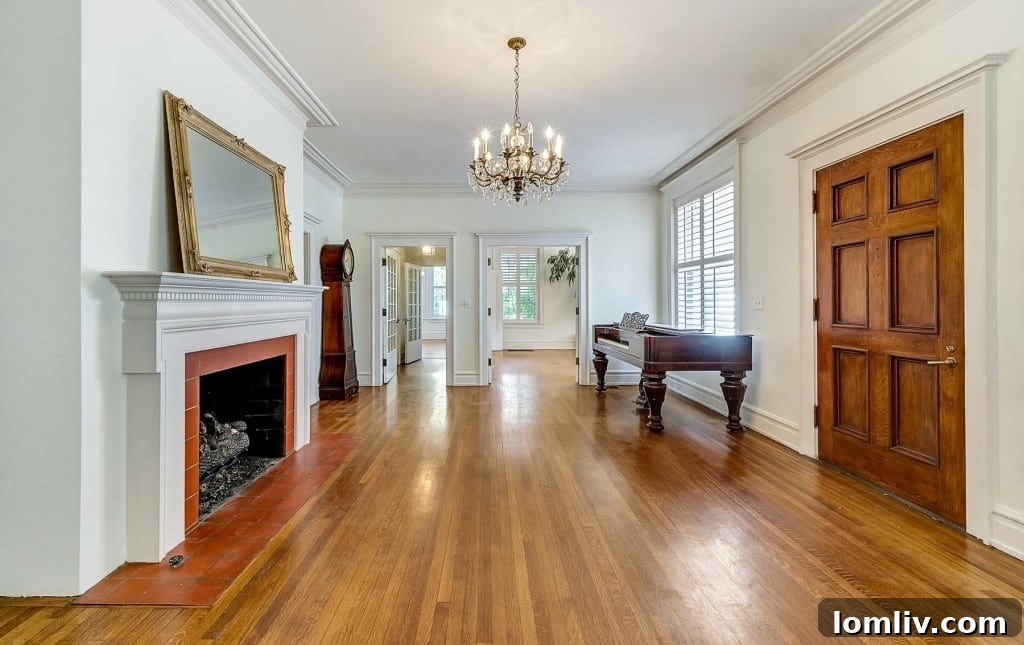 Mystical Allure of Mistletoe Heights Historic Villa 5 Spacious Living Room Featuring Hardwood Floors and Natural Light in 1919 Waggoner Residence