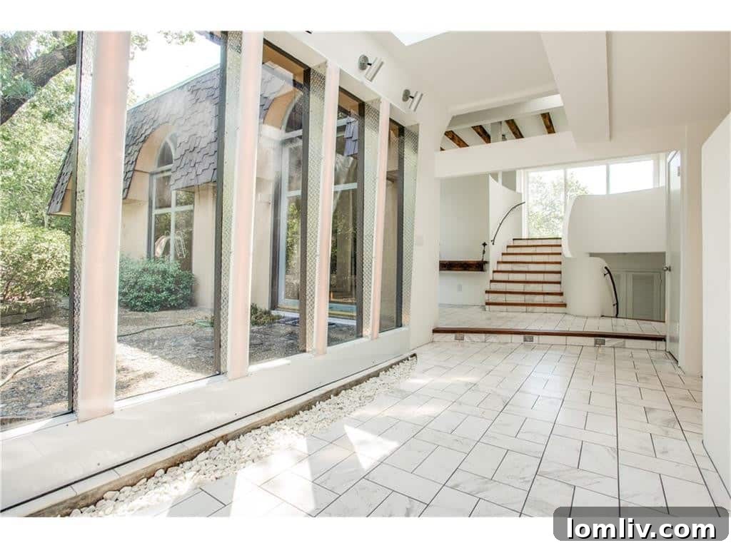 Elegant staircase ascending in the Canyon Drive celebrity home