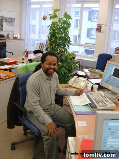 Modern home office setup with dual monitors and a clean desk, suitable for remote work.