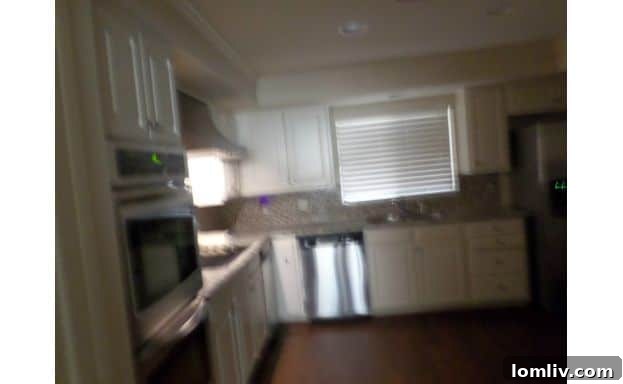 A blurry, tilted kitchen photo creating a disorienting, sinking sensation