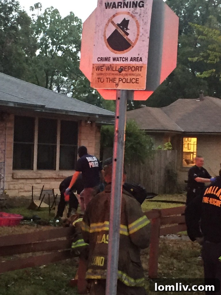Crime Watchers sign ironically placed near the East Dallas marijuana grow house fire