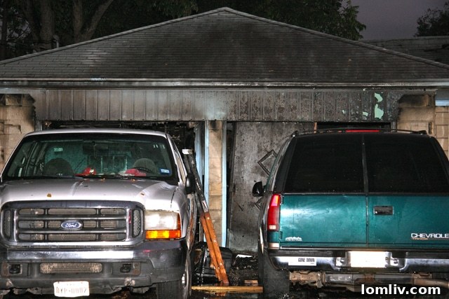 Damaged garage of the East Dallas grow house following explosion and fire