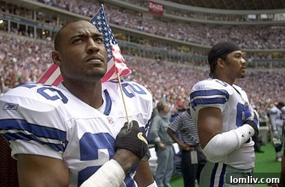 Darren Woodson listens during pre-game festivities hosted in San Diego