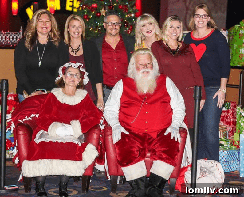 JP & Associates REALTORS holiday scholarship event with Santa Claus