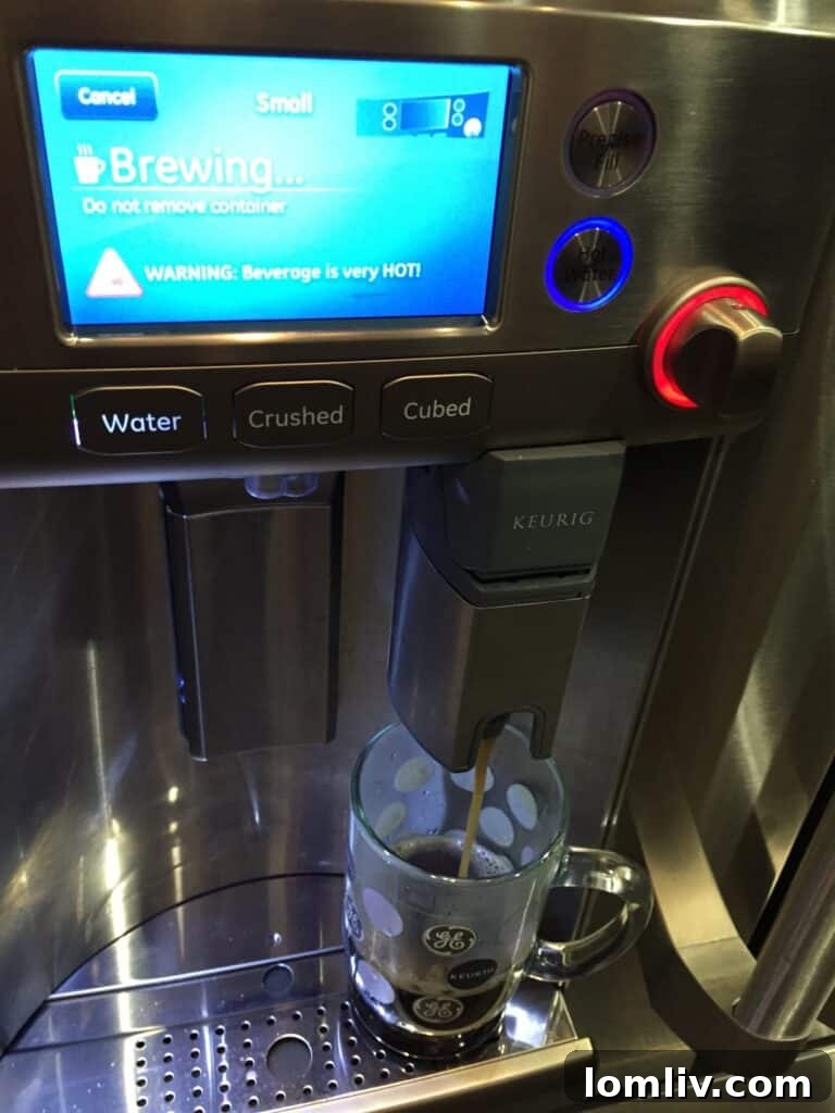 GE Cafe French door refrigerator with an integrated Keurig coffee brewing system.